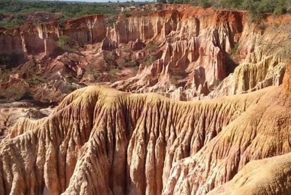 A wide view across the eroded sandstone canyons of the Marafa Depression